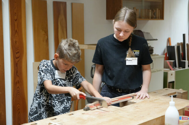 holiday-games-2025-external-boy-sawing