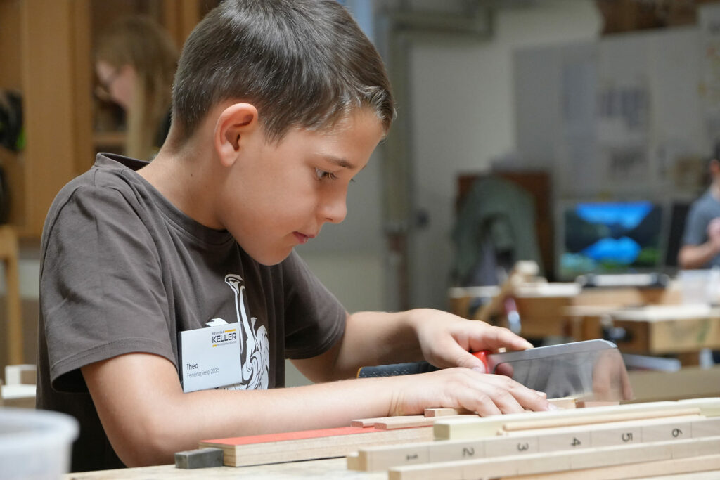 holiday-games-2025-internal-boy-sawing